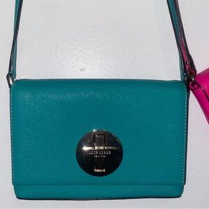 Kate spade crossbody bag with a unique cross turnlock- turquoise